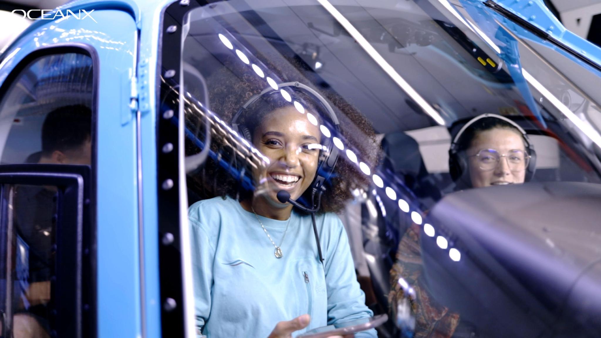 Young Explorers Program student, Makai Williams, aboard the OceanXplorer helicopter